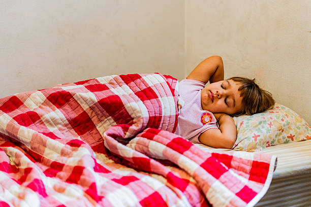 Little girl sleeping at home
