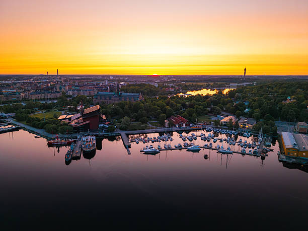 Aerial view of stockholm, sweden reflecting in the baltic sea during a golden hour sunset