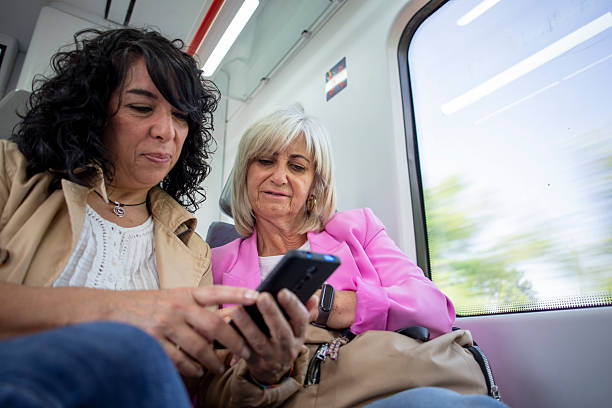 istock Senior lesbian couple traveling by train 2220465598