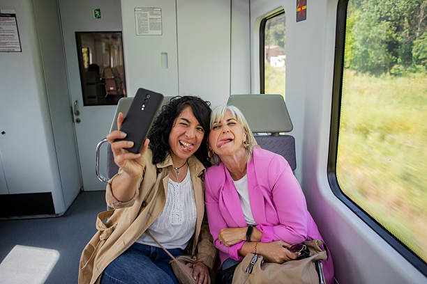 istock Senior lesbian couple traveling by train 2220465768