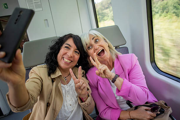 istock Senior lesbian couple traveling by train 2220465843