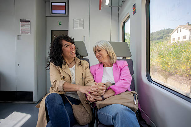 istock Senior lesbian couple traveling by train 2220466120