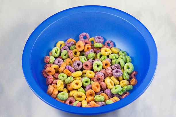 istock A vibrant blue bowl filled with colorful puffed cereal, representing breakfast joy and childhood nostalgia, perfectly suited for promoting cereals and fun food imagery. 2220466215