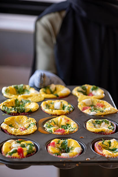 istock Freshly Baked Spinach and Cheese Egg Muffins in a Tray 2220466446