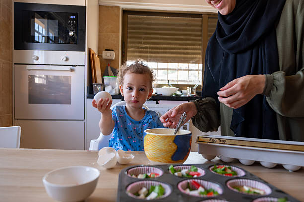 istock Mother and Child Baking Together in a Cozy Kitchen Setting 2220466652