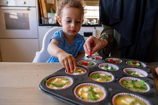 istock Mother and Child Baking Together in a Cozy Kitchen Setting 2220466677