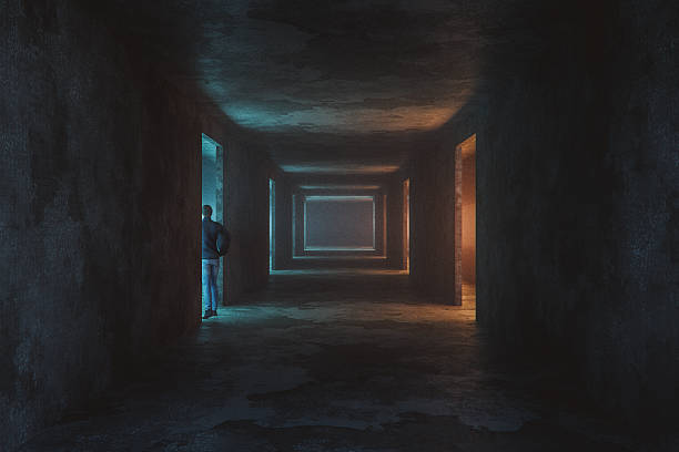 Man walking in spooky dark underground corridor