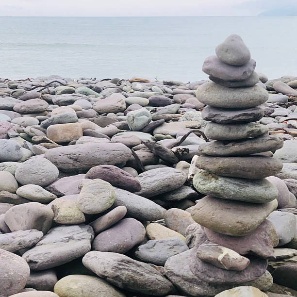 istock Stacked rocks - stone balancing, prayer stone stacks or cairns 2220469684