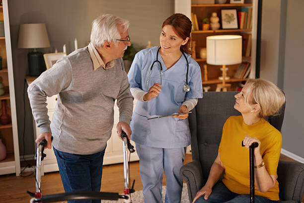 istock Nurse assisting elderly man using walker in home care setting 2220471593