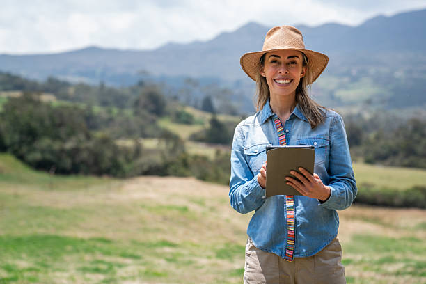 istock Happy tourist outdoors holding a digital tablet and smiling 2220472617