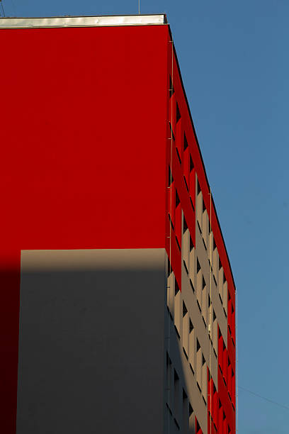 istock A vibrant red building is set against a clear blue sky backdrop 2220475639
