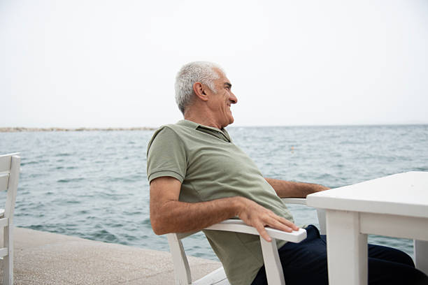istock Mature man by the sea 2220476125