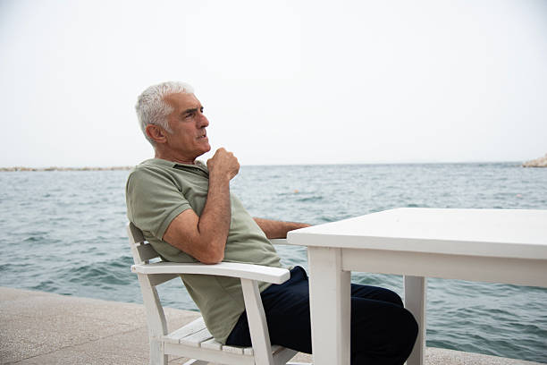 istock Mature man by the sea 2220476160