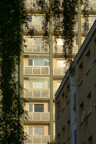 istock A very tall building featuring numerous windows and multiple balconies 2220477788