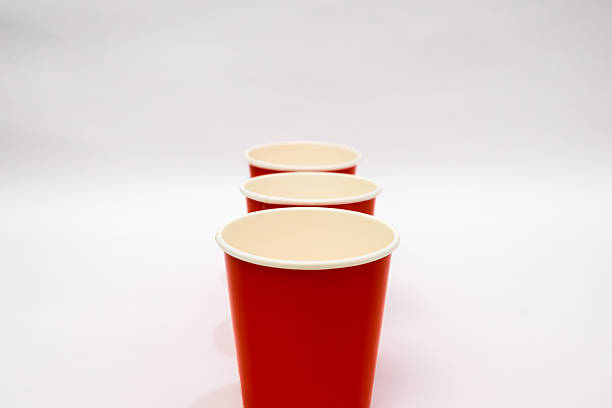 Closeup reusable plastic cup on red background