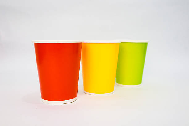 istock Colorful Disposable Paper Cups on White Background: A Vibrant Still Life 2220479862