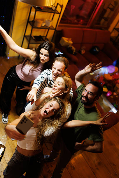 istock Friends Gather and Enjoy Socializing While Taking a Group Selfie 2220483294