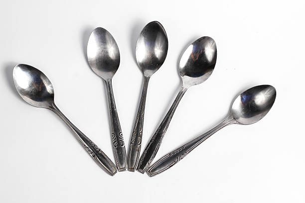 istock Bunch of iron spoons isolated on white background.interior home appliances 2220484377