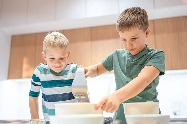 istock Happy Caucasian Brothers Baking Together at Home 2220484967