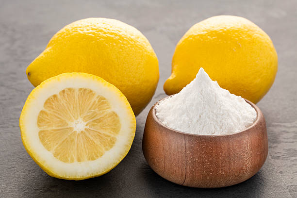 istock Bowl with baking soda and sliced lemons - Citrus Limon 2220486915