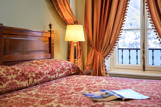 istock Elegant classical bed with lake view 2220489651