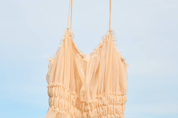 istock Elegant summer dress displayed against a blue sky 2220491212