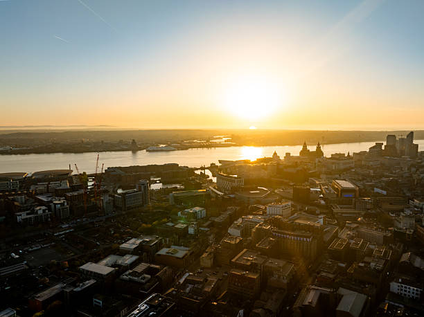 istock Liverpool cityscape basking in golden sunrise: drone view 2220493146