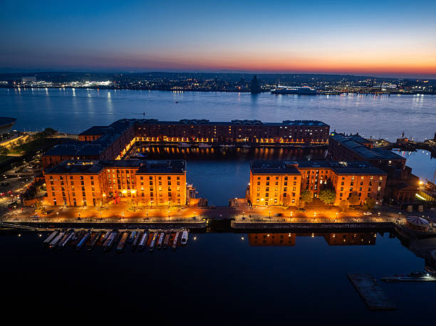 Liverpool's royal albert dock glowing at sunset, aerial view