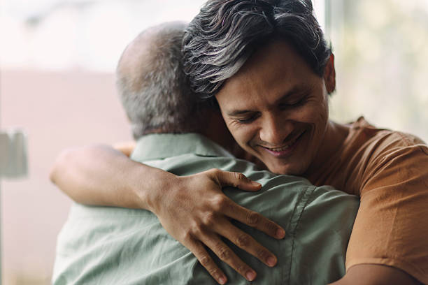 istock Latino men hugging in their garden 2220493257