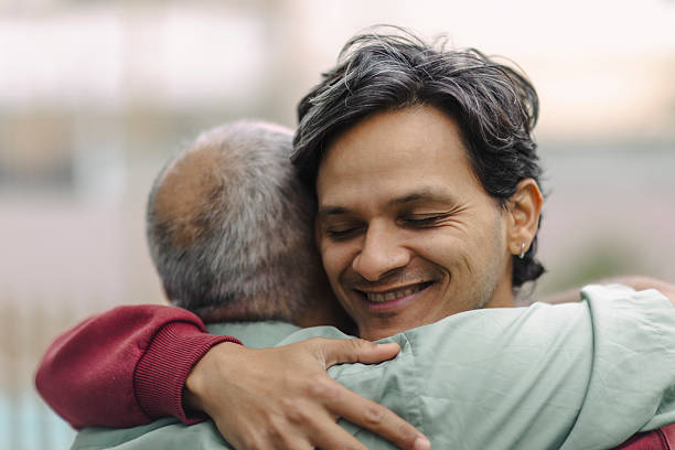 istock Latino men hugging in their garden 2220493274