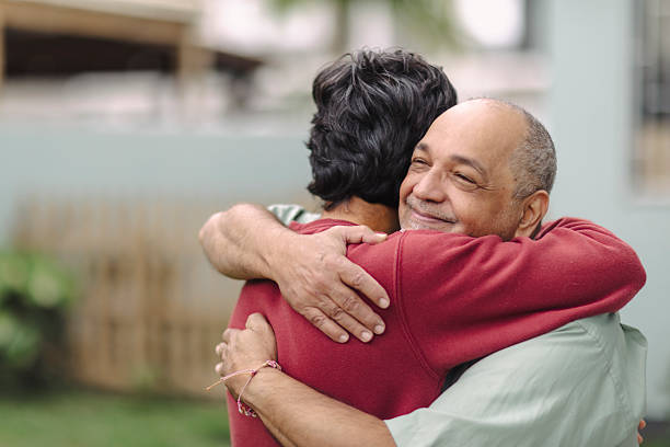 istock Latino men hugging in their garden 2220493279