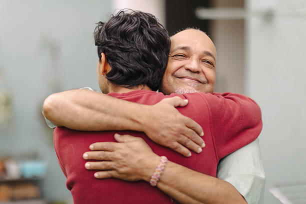 istock Latino men hugging in their garden 2220493281