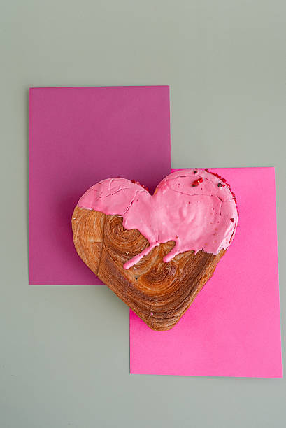 istock Valentine's Day Birthday holiday present gift idea Coffee cappuccino latte beverage drink Morning breakfast Holiday birthday anniversary shiny candle sparkler on cake Delightful and vibrant heartshaped pastry croissant treat, beautifully topped with 2220493930