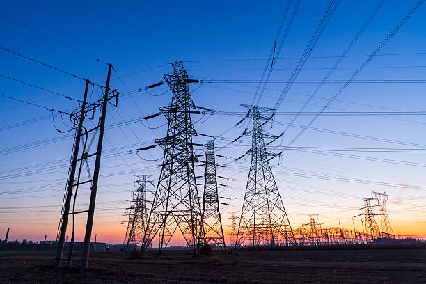 istock Pylons, high voltage pylons in the evening 2220496693