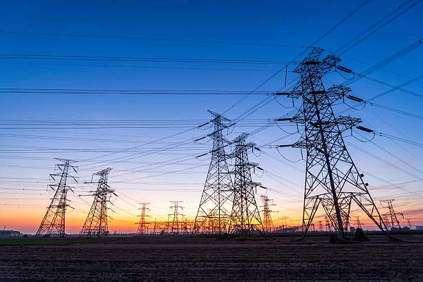 istock Pylons, high voltage pylons in the evening 2220496696
