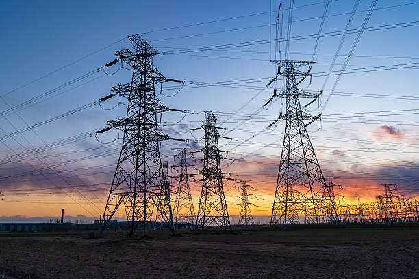 istock Pylons, high voltage pylons in the evening 2220497246