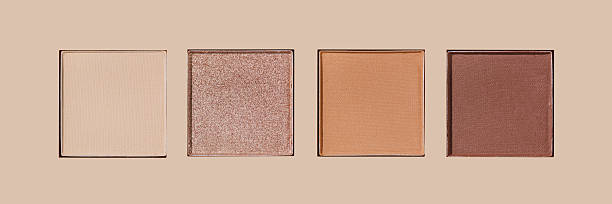 istock Neutral Eyeshadow Palette with Matte and Shimmer texture, natural colored shades on beige. Set of eyeshadow refills, Top view of four Swatches Eyeshadow makeup for cosmetic, makeup, beauty concept 2220497463