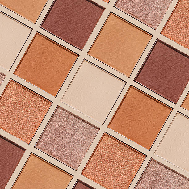 istock Cosmetics texture pattern, makeup palette vivid neutral color eye shadow, square eye powder swatches. Female cosmetic and beauty products, aesthetic minimal beauty photo, colorful eyeshade, top view 2220497483