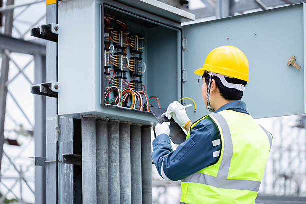 istock Engineer is working on high voltage power substation performing inspection and check of electrical infrastructure to ensure safety and proper operation 2220497938