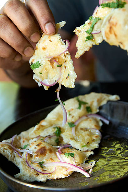 istock Hand-Torn Naan with Onion and Herbs 2220501597