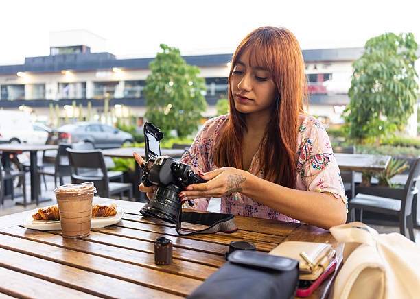 istock Teenager learning how to use 35mm film camera 2220501953
