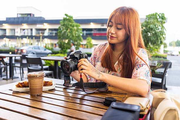istock Teenager learning how to use 35mm film camera 2220501983