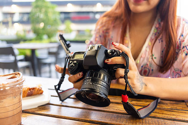 Woman learning how to use a 35mm film camera