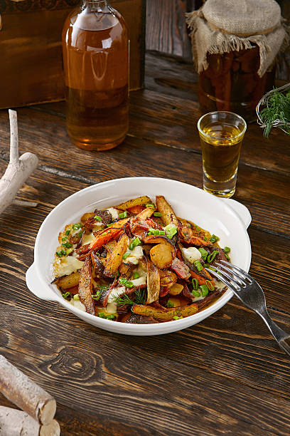istock Fried potatoes with onions, rustic bright mood, overhead composition in white ceramic bowl 2220502838