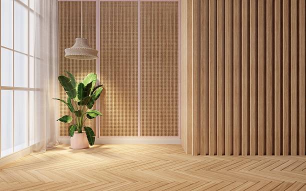 istock Empty room style minimalist interior design with natural wooden wall textures, vertical wooden slats, rattan paneling, and a large potted tropical plant placed near a window with sheer curtains.3d rendering 2220503689