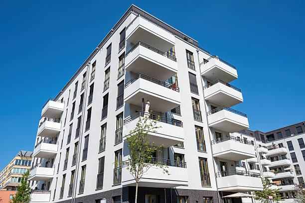 istock White multi-family residential building 2220504488