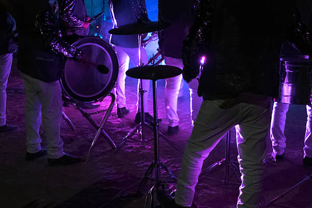Young Asian chinese lead singer and live band Multiracial group performance on stage