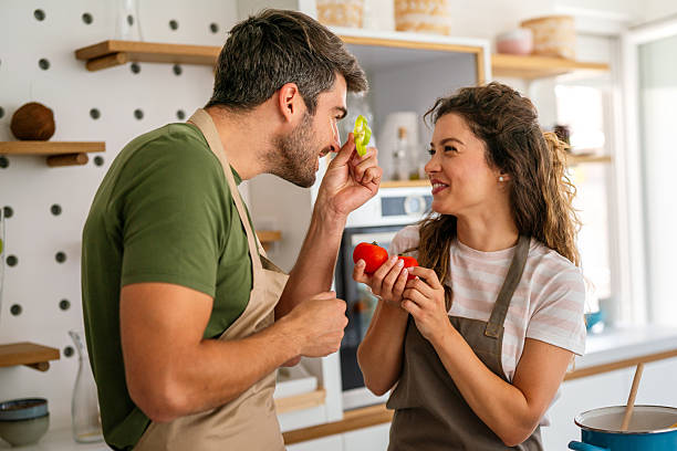 istock A young couple in love having good time while preparing a breakfast together on a beautiful morning 2220512754