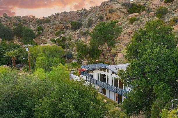 istock Elegant View Home with Designer Interiors, Panoramic Windows, and Scenic Rolling Hills Vistas 2220514013