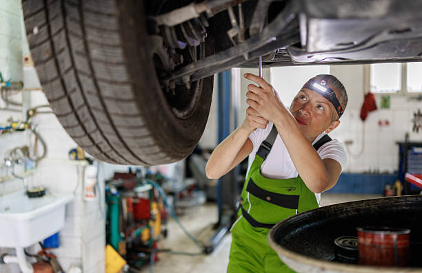 istock Lifted Vehicle Oil Service with Fluid Pump Extractor 2220515509